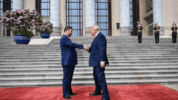 Di Beijing, Gestur Jabat Tangan Trump dan Xi Jadi Sorotan di Tengah Ketegangan Global